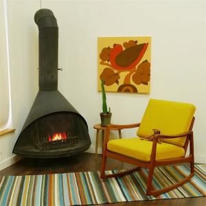 China Vintage Mid Century Indoor Black Freestanding Cone Wood Burning Fireplace wholesale